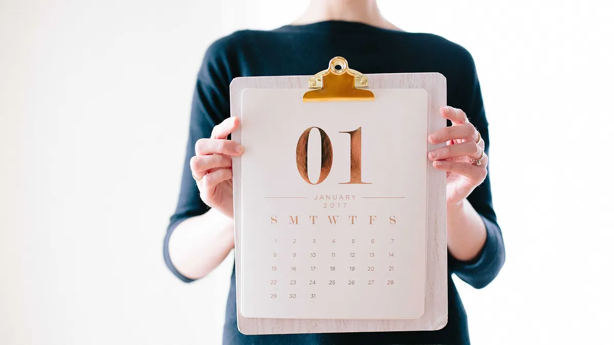 A paper calendar and planner laid out with a study schedule